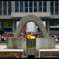 Peace Flame with the Peace Memorial Museum in the background, Hiroshima, Honshu, Japan